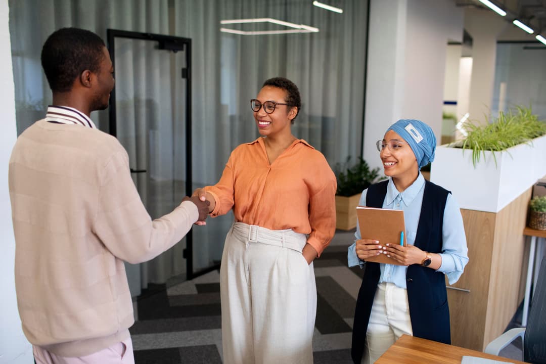 Team collaborating to reflect TRINETRA's values of diversity and growth